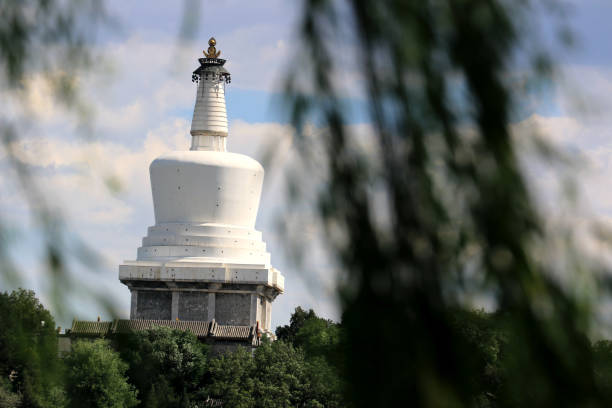 istock The white tower hide behind tree as background in Beihai Park in Beijing 823662214