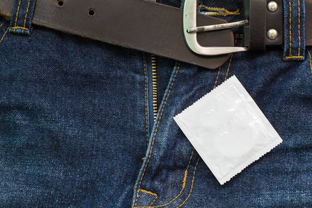 jeans open zip with condom, safe sex concept