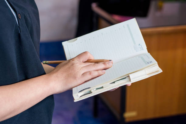 istock business women take a note on the book 823675602