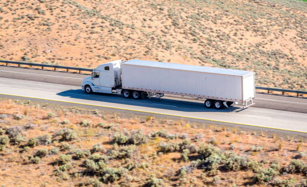 istock Semi truck running in desert 823679746
