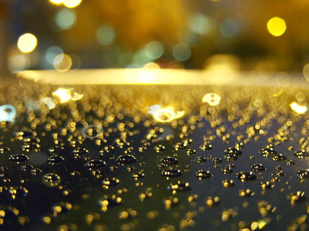 istock Close-up raindrops on car roof 823683760
