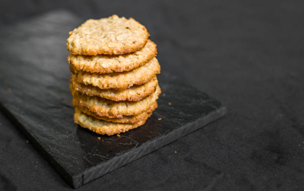 istock Peanut butter oatmeal cookies against black background 823683776
