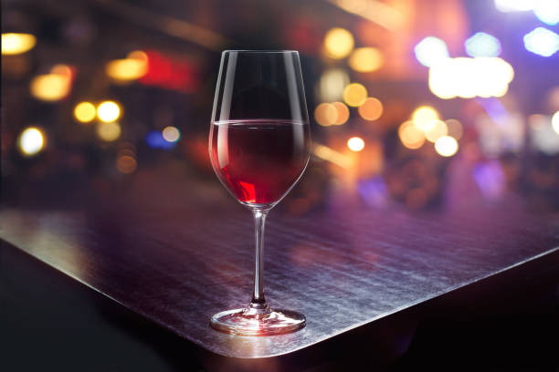 istock Wine glass on the colorful bar background 823686890