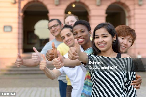 Group Of Young People With Thumbs Up Stock Photo - Download Image Now - Group Of Objects, Germany, People