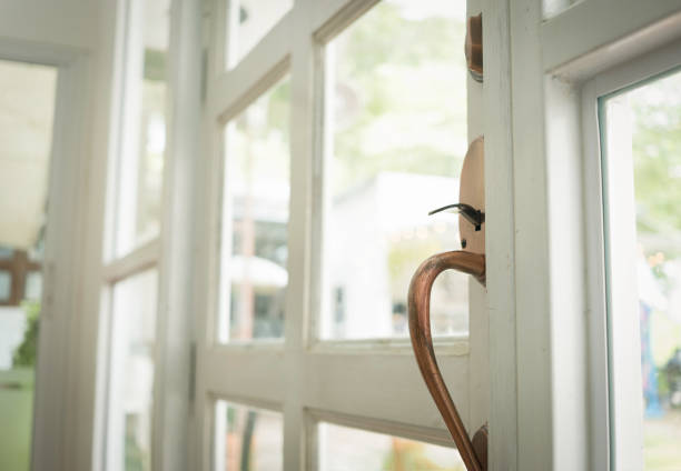 Close up white wooden door on daylight background