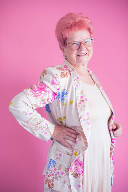 istock Smiling senior woman with hand on hips 823691144