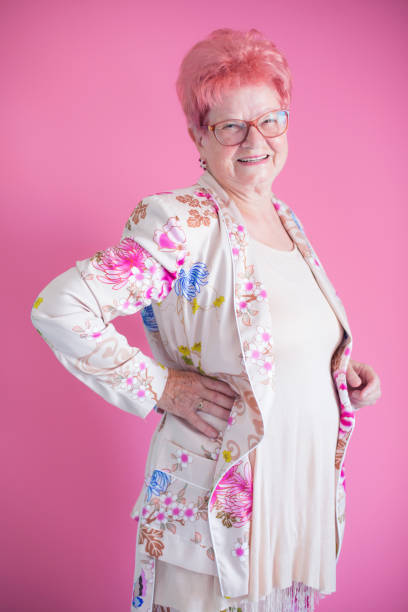 istock Smiling senior woman with hand on hips 823691322