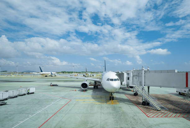 istock airplane on airport in cloud sky 823695324