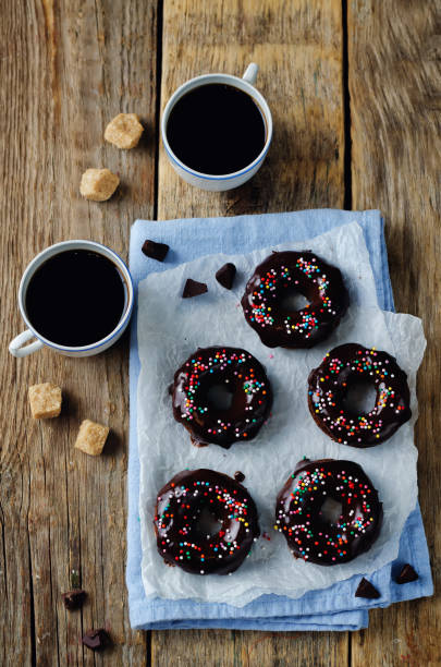 istock Baked chocolate doughnuts with chocolate glaze 823701484