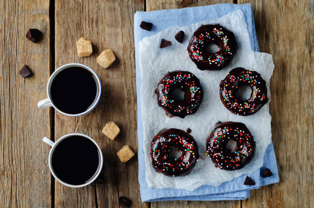 istock Baked chocolate doughnuts with chocolate glaze 823701486
