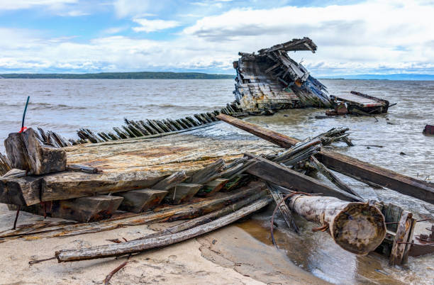 istock Baie-Saint-Paul in Quebec, Canada shipwreck in water with waves 823705060