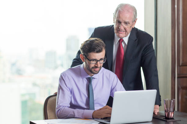 istock Serious Senior Boss Consulting Colleague 823709182