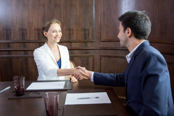 istock Smiling Business Partners Shaking Hands 823709240