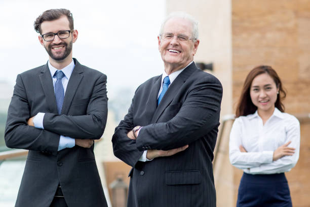 istock Three Smiling Diverse Colleagues on Roof Top 823709388