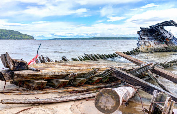 istock Baie-Saint-Paul in Quebec, Canada shipwreck in water with waves 823709476