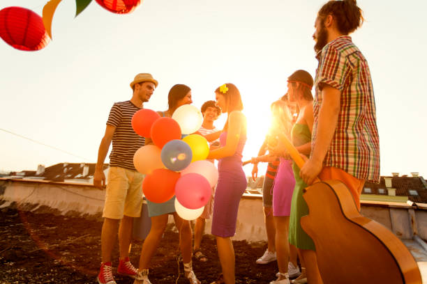 istock Meeting with friends at rooftop party 823712324
