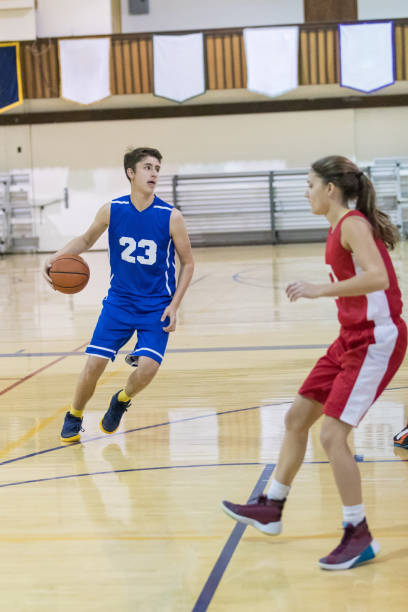 istock Mixed gender high school basketball scrimmage 823719262