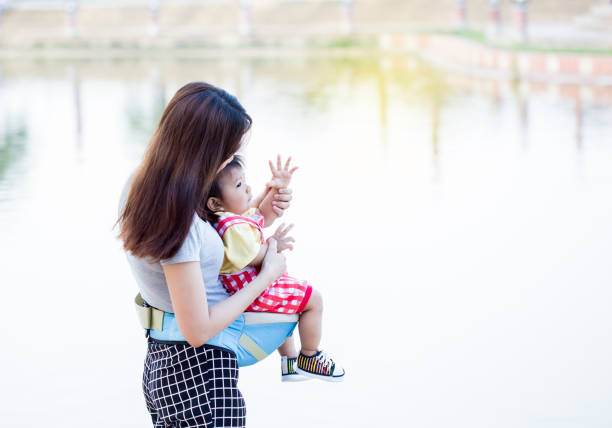 istock Mother and young son having fun in the park 823725610