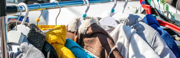istock used baby winter clothes, jackets and coats displayed on rack 823730266