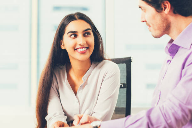 istock Smiling Male and Female Coworkers Talking at Work 823736502