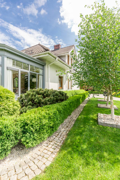istock White house surrounded by garden 823740892