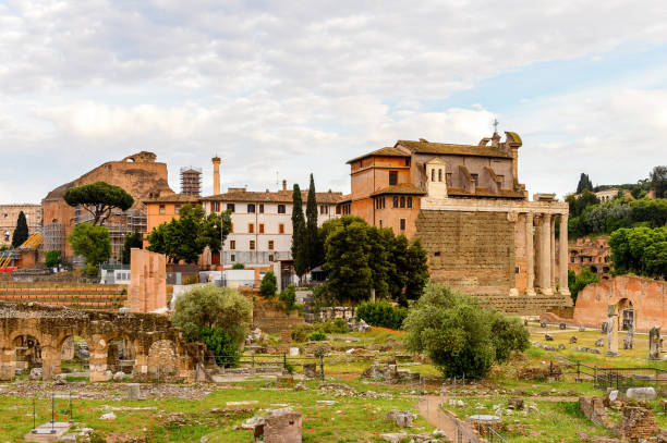 istock Roman Forum in the evening, a rectangular forum surrounded by the ruins of several important ancient government buildings at the center of the city of Rome. 823741562