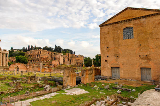 istock Roman Forum in the evening, a rectangular forum surrounded by the ruins of several important ancient government buildings at the center of the city of Rome. 823743240