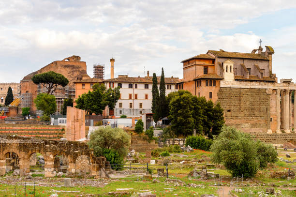 istock Roman Forum in the evening, a rectangular forum surrounded by the ruins of several important ancient government buildings at the center of the city of Rome. 823743662