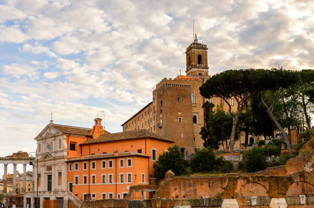 istock Roman Forum in the evening, a rectangular forum surrounded by the ruins of several important ancient government buildings at the center of the city of Rome. 823743718