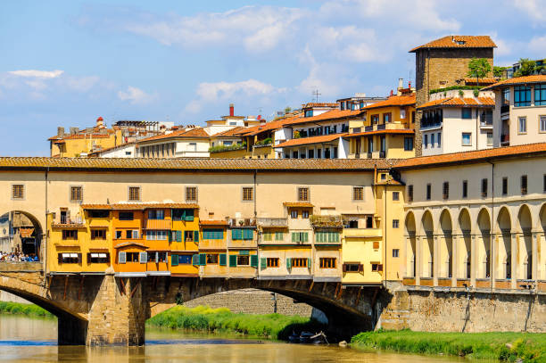 istock Ponte Vecchio (Old Bridge), a Medieval stone closed-spandrel segmental arch bridge over the Arno River, in Florence, Italy. 823755178