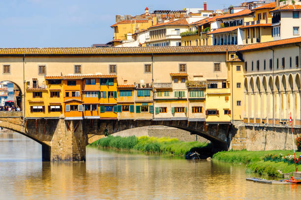 istock Ponte Vecchio (Old Bridge), a Medieval stone closed-spandrel segmental arch bridge over the Arno River, in Florence, Italy. 823755782