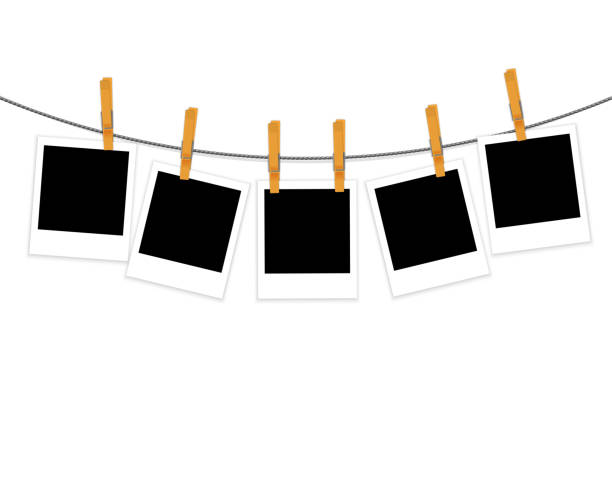 Photo frames on rope with clothespins vector Photo frames on rope with clothespins isolated on white background vector clothesline photos stock illustrations