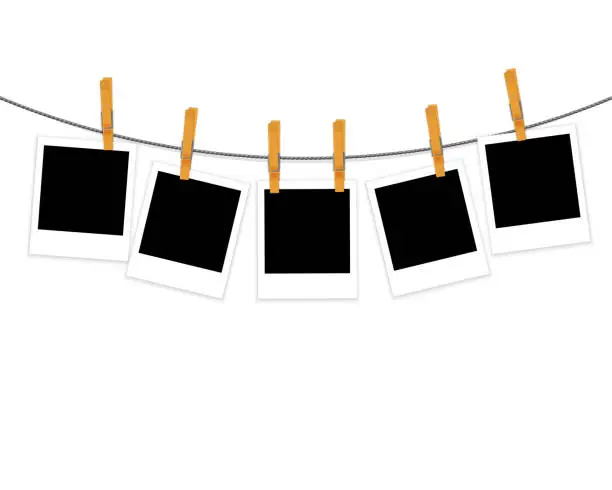 Vector illustration of Photo frames on rope with clothespins vector