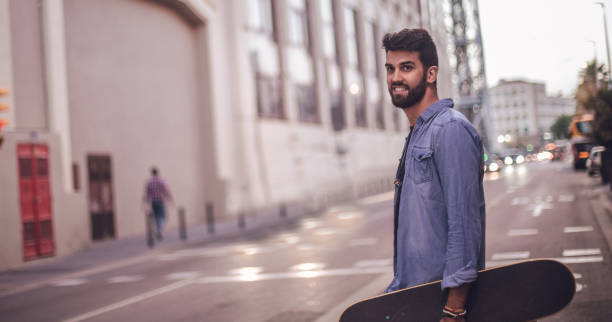 istock Handsome skater in city 823760096