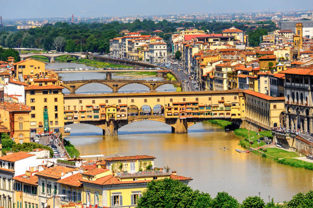 istock Ponte Vecchio (Old Bridge), a Medieval stone closed-spandrel segmental arch bridge over the Arno River, in Florence, Italy. View from the Michelangelo Square 823760566