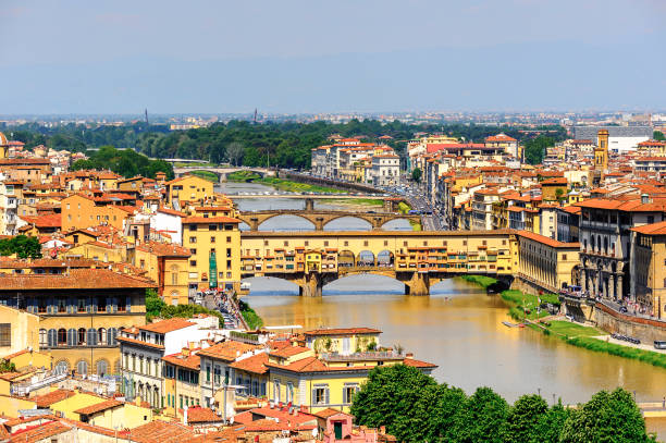 istock Ponte Vecchio (Old Bridge), a Medieval stone closed-spandrel segmental arch bridge over the Arno River, in Florence, Italy. View from the Michelangelo Square 823760752