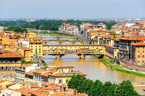 istock Ponte Vecchio (Old Bridge), a Medieval stone closed-spandrel segmental arch bridge over the Arno River, in Florence, Italy. View from the Michelangelo Square 823762766