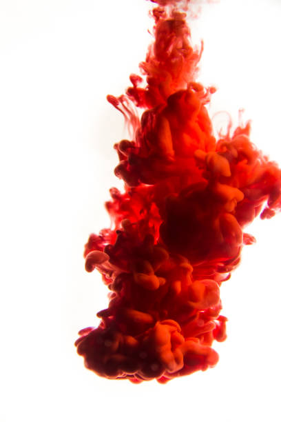 istock red ink in water isolated on white background 823763518