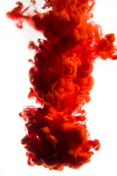 istock red ink in water isolated on white background 823763782