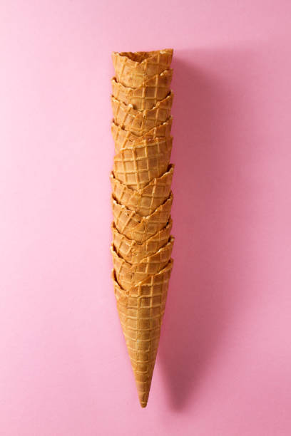 istock Tasty fresh empty ice cream cones on pink vibrant background. Flat Lay. Minimalism Concept. 823767486