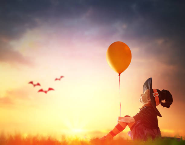 istock little witch outdoors 823771462