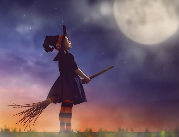 istock little witch outdoors 823771560