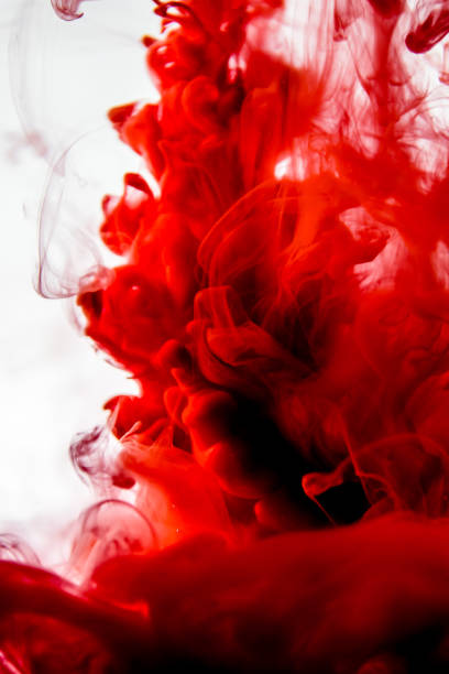 istock red ink in water isolated on white background 823771996