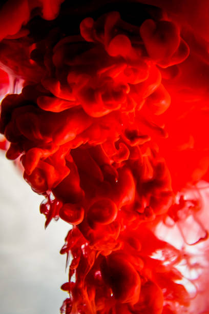 istock red ink in water isolated on white background 823772220