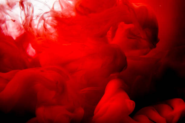 istock red ink in water isolated on white background 823772374