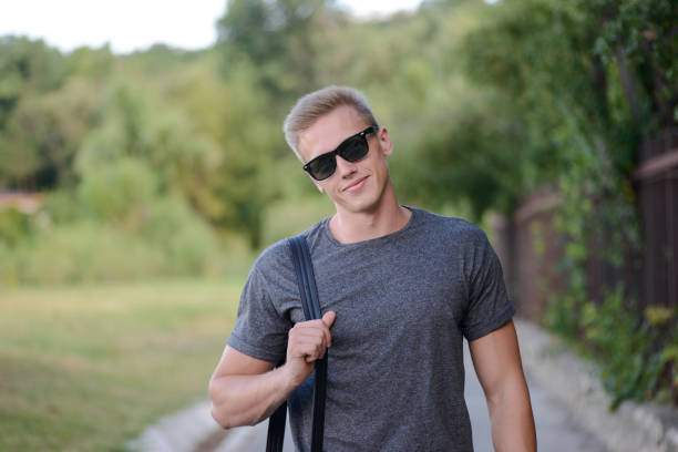 istock A young guy in glasses walks in the park 823776448