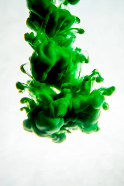 istock green ink in water isolated on white background 823781236