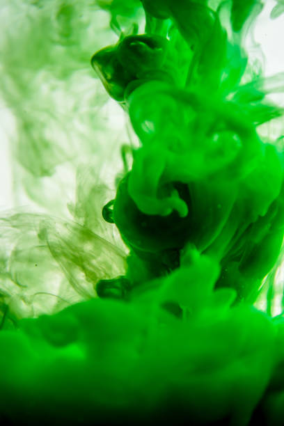 istock green ink in water isolated on white background 823781378