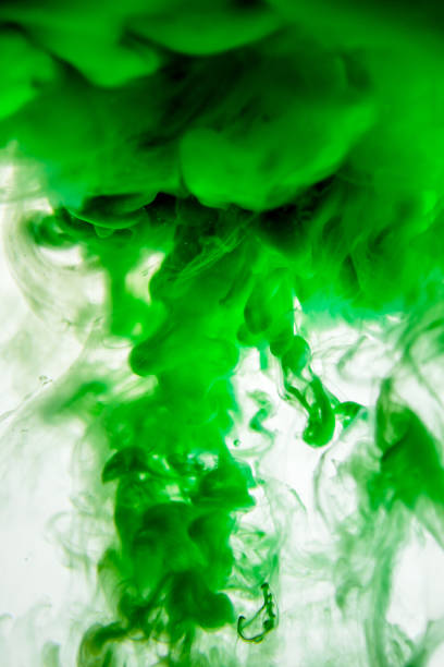 istock green ink in water isolated on white background 823781446