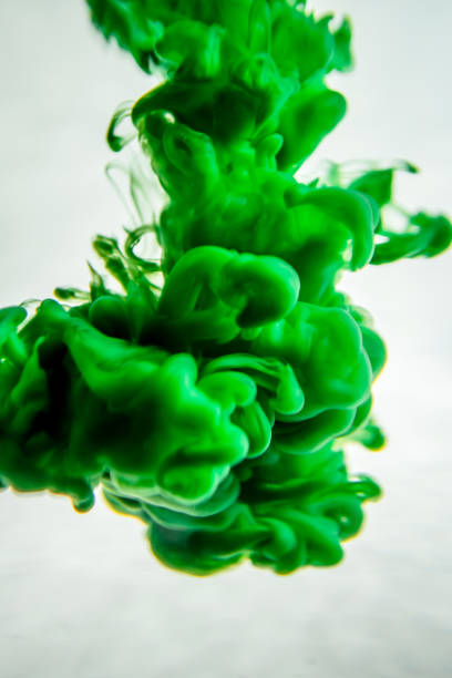 istock green ink in water isolated on white background 823781618